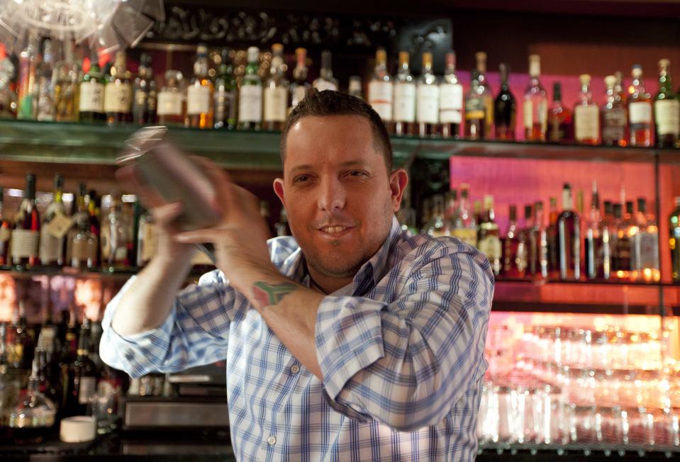 In this photo taken Thursday, Dec. 20, 2012, mixologist Jacques Bezuidenhout shakes up a cocktail in the Starlight Room of the Sir Francis Drake Hotel in San Francisco. The first rule of drinking on a diet is, don't. Surely you saw the recent study that found that Americans were getting almost as many empty calories from alcohol as from soft drinks. The second rule of drinking on a diet is that since you probably will ignore Rule No. 1, find a way to enjoy alcohol without letting it swamp your healthy intentions. (AP Photo/Eric Risberg)