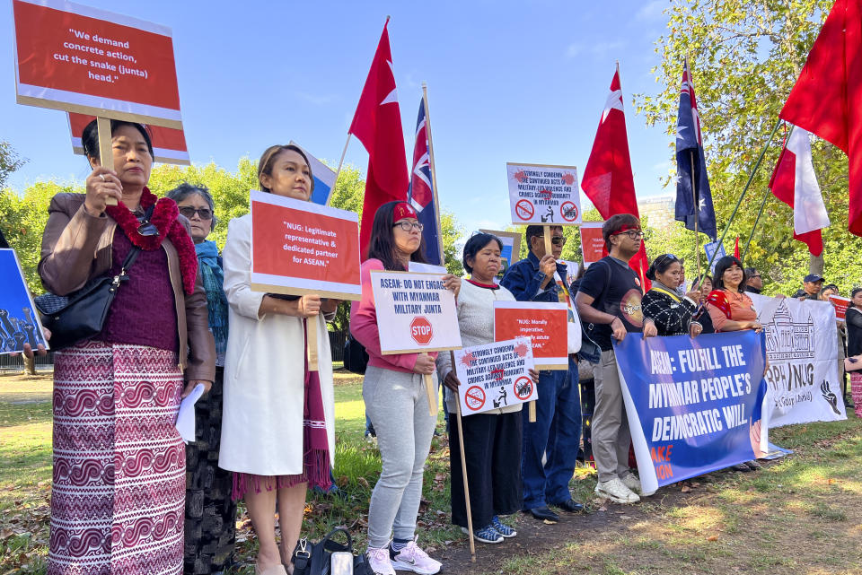 Demonstrators hold placards protesting outside the ASEAN Special Summit in Melbourne, Australia, Monday, March 4, 2024.The small group of members of the Myanmar community held a protest urging ASEAN not to support Myanmar's government. (AP Photo/Johnson Lai)