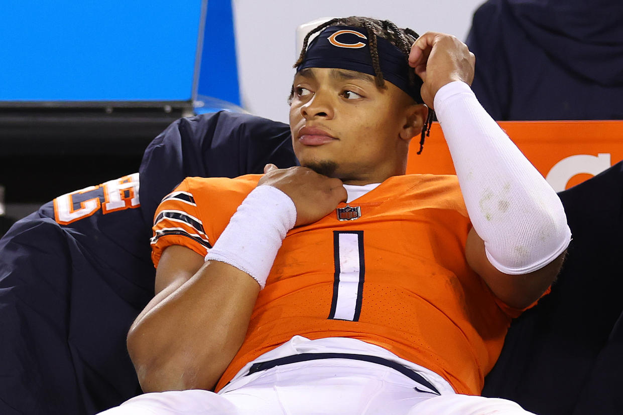 CHICAGO, ILLINOIS - OCTOBER 13: Justin Fields #1 of the Chicago Bears reacts after losing against the Washington Commanders at Soldier Field on October 13, 2022 in Chicago, Illinois. (Photo by Michael Reaves/Getty Images)