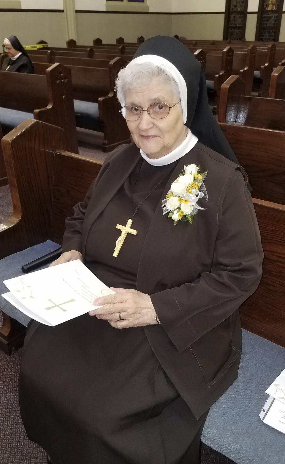 In this photo provided by Sister Mary Jeanine Morozowich, Sister Mary Evelyn Labik is recognized for her 60 years with the Felician Sisters of North America, in Greensburg, Pa., on Oct. 4, 2020. Labik contracted the coronavirus soon after and died. (Sister Mary Jeanine Morozowich via AP)