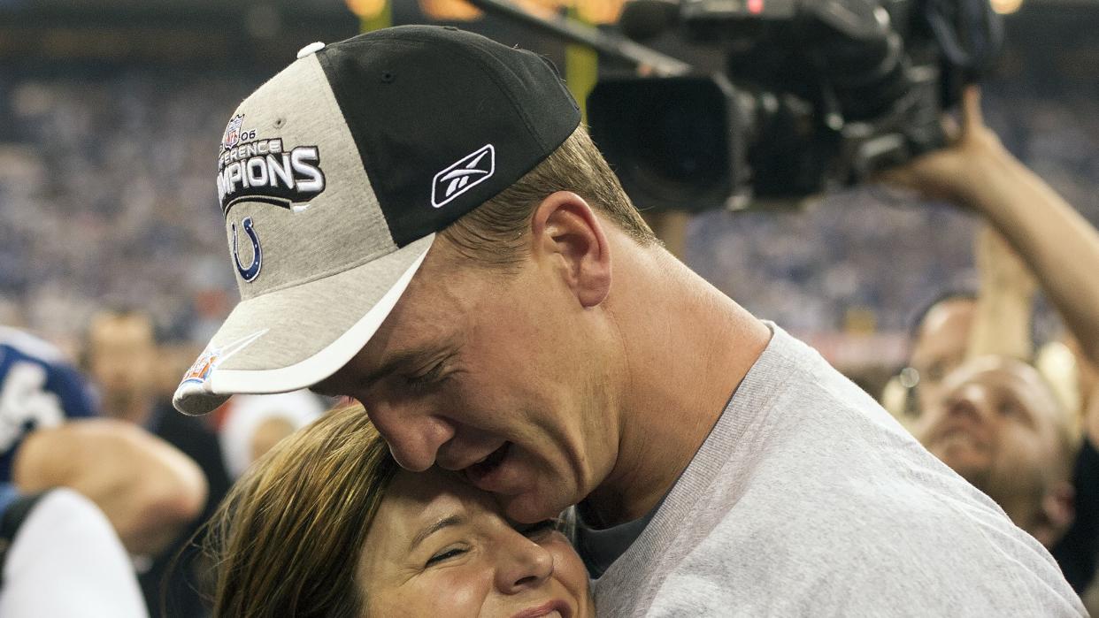 Peyton Manning hugging wife Ashley after winning game vs New England Patriots at RCA Dome. Indianapolis, IN 1/21/2006