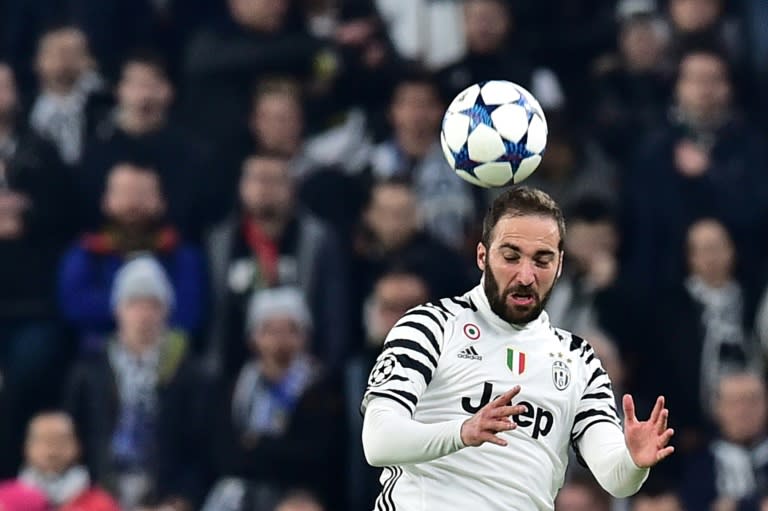 Juventus' forward from Argentina Gonzalo Higuain jumps for the ball during the UEFA Champions League football match against Porto on March 14, 2017