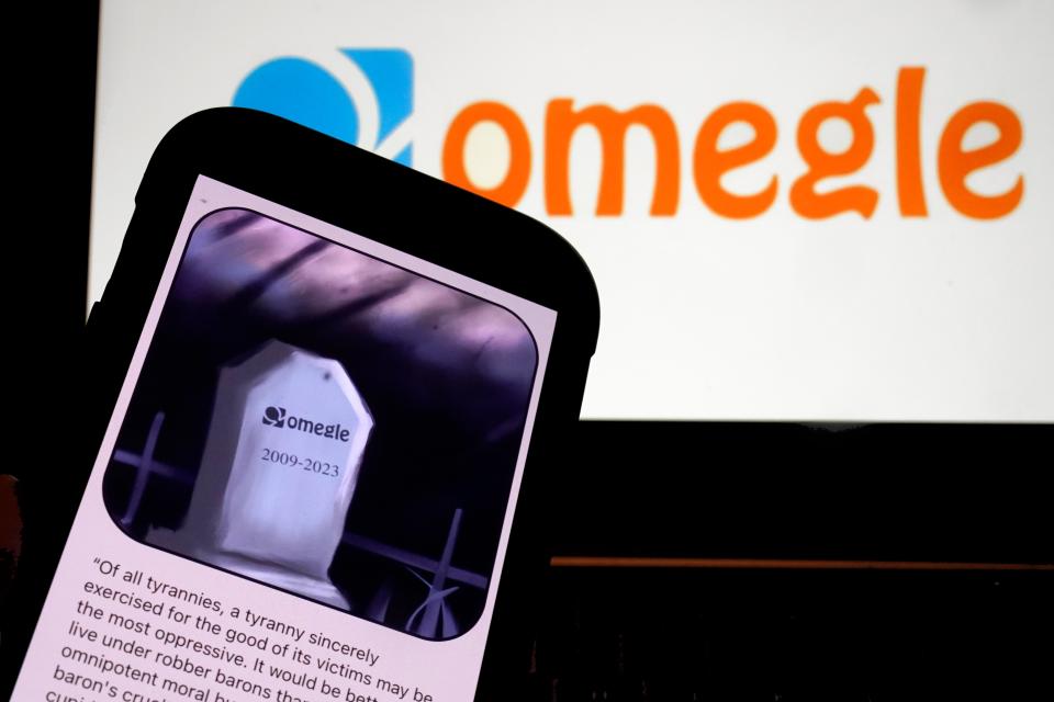 This photo, in New York, Thursday, Nov. 9, 2023, shows the Omegle logo, and their website posting on a mobile phone. Omegle is shutting down after 14 years after the popular video chat platform intended as a place for people to connect anonymously became known as a place where sexual abuse and racism festered.