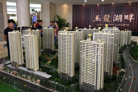 Models of residential buildings are seen at a sales center in Bengbu, Anhui province, China July 9, 2017. Picture taken July 9, 2017. REUTERS/Yawen Chen