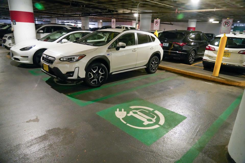 A charging station for hybrid electric vehicles in the state Department of Transportation parking garage.