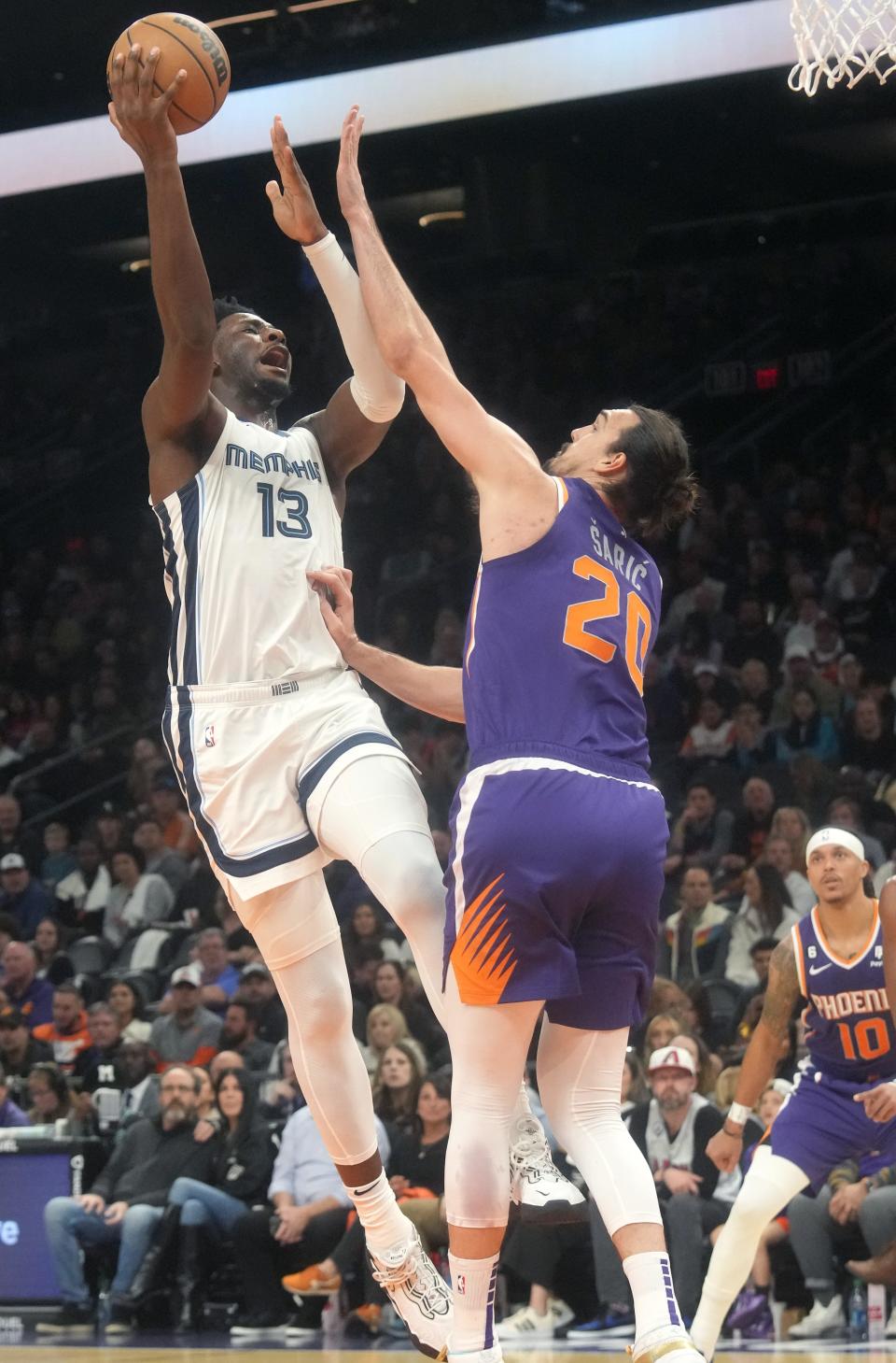 Jan 22, 2023; Phoenix, Arizona, USA; Memphis Grizzlies forward Jaren Jackson Jr. (13) shoots the ball over Phoenix Suns forward Dario Saric (20) at Footprint Center. Mandatory Credit: Joe Rondone-Arizona Republic