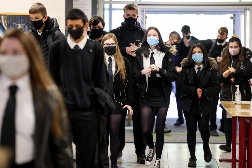 GLASGOW, SCOTLAND - AUGUST 31: Pupils at Rosshall Academy wear face coverings as it becomes mandatory in corridors and communal areas on August 31, 2020 in Glasgow, Scotland. New rules starting today require children over 12 to wear face coverings in corridors and other communal areas in schools in Scotland. Face coverings are not mandatory in classrooms. (Photo by Jeff J Mitchell/Getty Images)