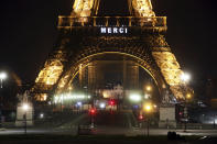 The word "Merci", the French word for 'Thank you", is emblazoned on the Eiffel Tower as France's coronavirus death toll continued to climb, in Paris, Friday, March 27, 2020. Health workers fighting to save lives in France from COVID-19 have received a huge show of gratitude, from the Eiffel Tower. The new coronavirus causes mild or moderate symptoms for most people, but for some, especially older adults and people with existing health problems, it can cause more severe illness or death. (AP Photo/Thibault Camus)