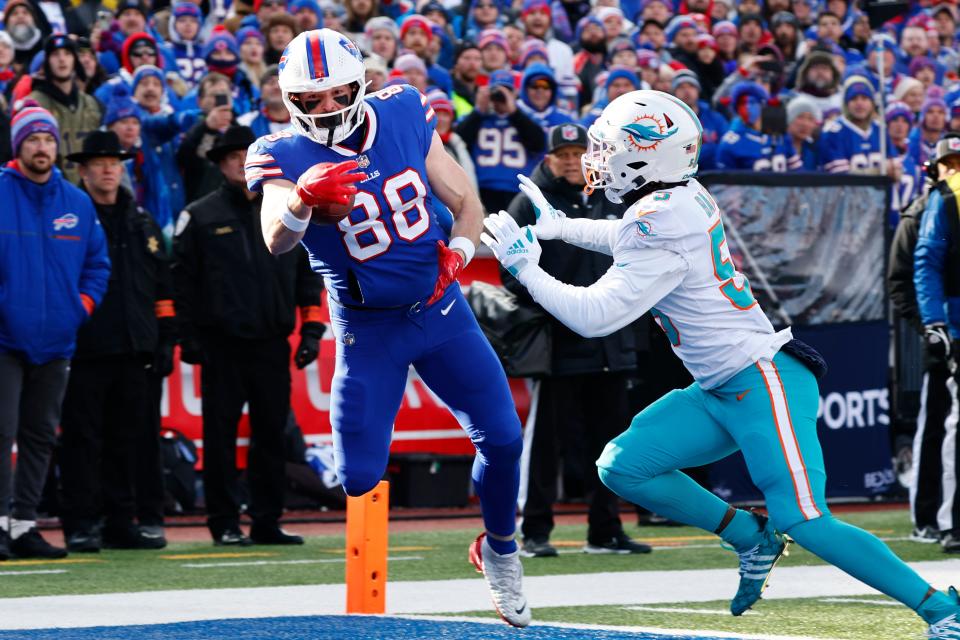 Dolphins linebacker Jerome Baker chases Dawson Knox of the Bills.