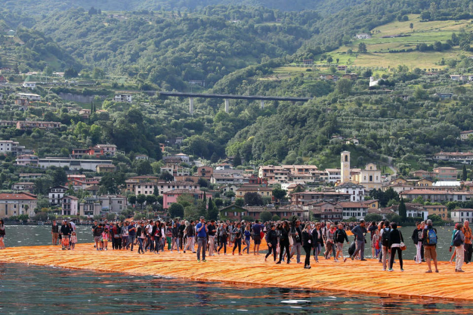 People walk on water at Italian lake 'Floating Piers’ installation