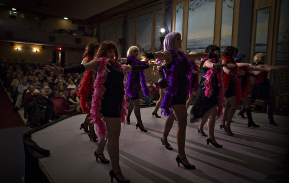 Local residents wear brilliantly coloured costumes during a vaudeville show. (Reuters)