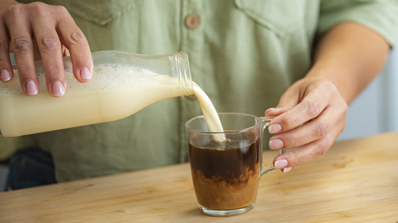 soy milk poured into coffee