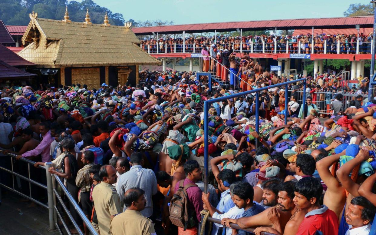 Hindu worshippers queue during a pilgrimage at the Sabarimala temple in Kerala - AP