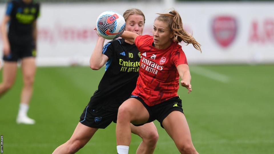 Arsenal's Kim Little and Victoria Pelova battle for the ball in training.