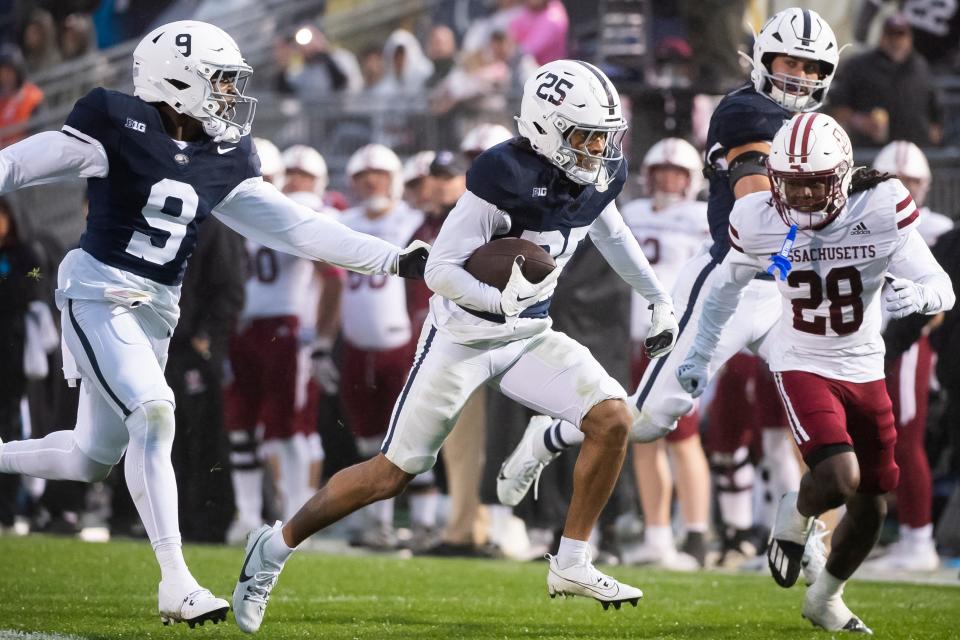 Penn State's Daequan Hardy (25) returns a punt 68 yards to score a touchdown, his second of the game, during the second half of a NCAA football game against Massachusetts Saturday, Oct. 14, 2023, in State College, Pa. The Nittany Lions won, 63-0.