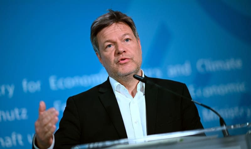 Robert Habeck Vice-Chancellor and German Minister for Economic Affairs and Climate Protection, speaks into a microphone. Habeck says the nation's power supply is more independent than before the energy crisis and is secure even after several coal-fired power plants have been shut down. Britta Pedersen/dpa