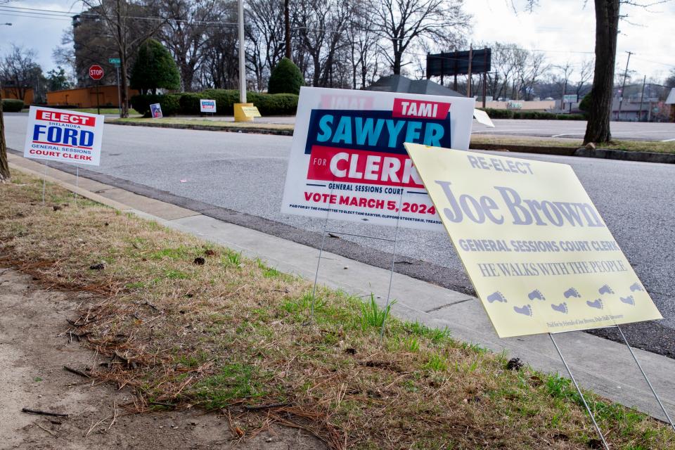 Signs for general sessions court clerk candidates are seen outside of the polling location at Mississippi Boulevard Christian Church in Memphis, Tenn., on Tuesday, March 5, 2024.