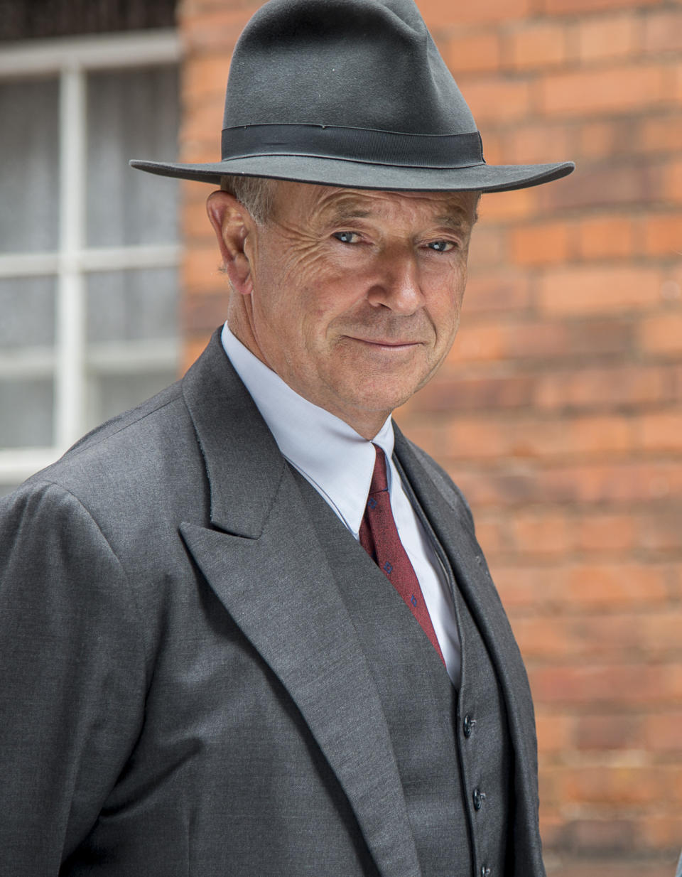 This image released by PBS shows Michael Kitchen from the series "Foyle's War," on "MASTERPIECE Mystery!" Precision is Kitchen's hallmark, such as the level gaze or tilt of the head he uses to great effect in "Foyle's War," which wraps its latest PBS season on Sunday. (AP Photo/PBS- ITV, Bernard Walsh)