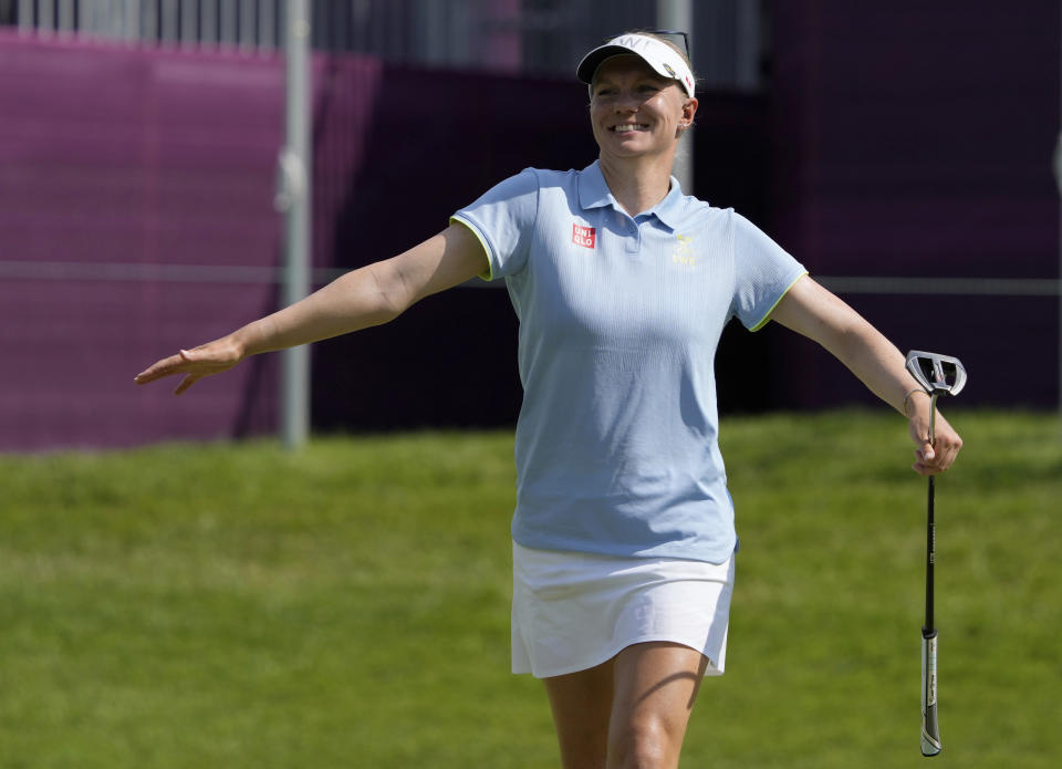 Madelene Sagstrom, of Sweden, celebrates after a birdie putt on the 15th hole during the first round of the women's golf event at the 2020 Summer Olympics, Wednesday, Aug. 4, 2021, at the Kasumigaseki Country Club in Kawagoe, Japan. (AP Photo/Andy Wong)