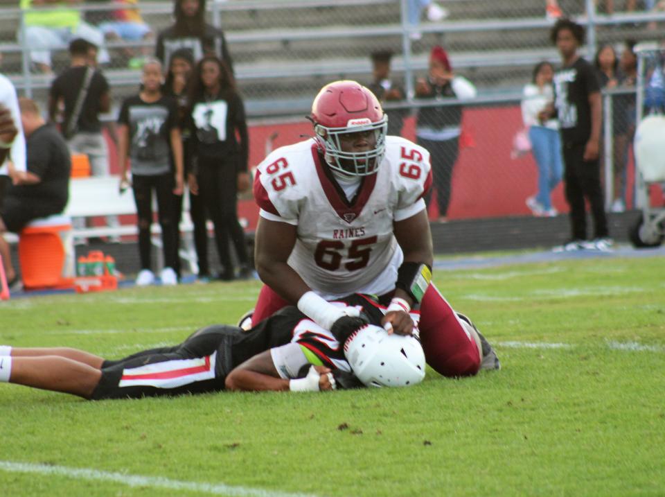 Solomon Thomas finishes a block versus a defender  during Raines' spring game versus Terry Parker.