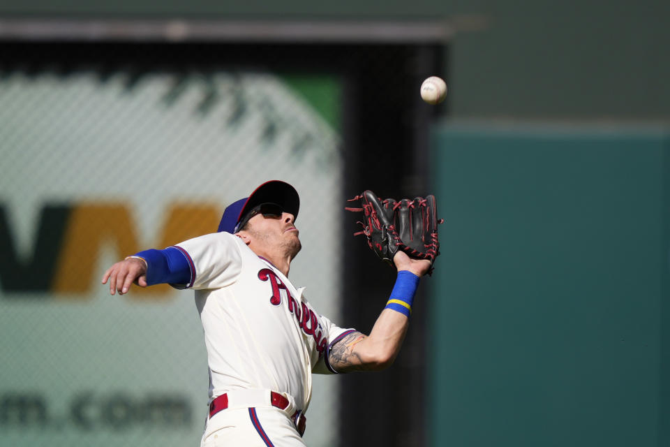 Philadelphia Phillies second baseman Bryson Stott catches a fly out by Toronto Blue Jays' Danny Jansen during the second inning of a baseball game, Wednesday, May 10, 2023, in Philadelphia. (AP Photo/Matt Slocum)