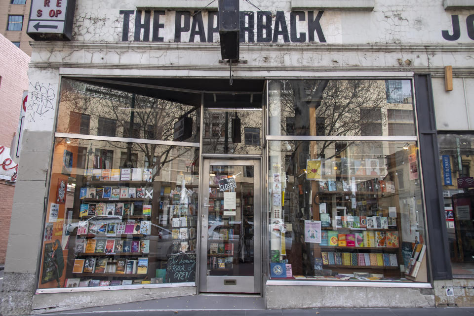 The Paperback bookstore sits closed during lockdown due to the continuing spread of the coronavirus in Melbourne, Thursday, Aug. 6, 2020. Victoria state, Australia's coronavirus hot spot, announced on Monday that businesses will be closed and scaled down in a bid to curb the spread of the virus. (AP Photo/Andy Brownbill)