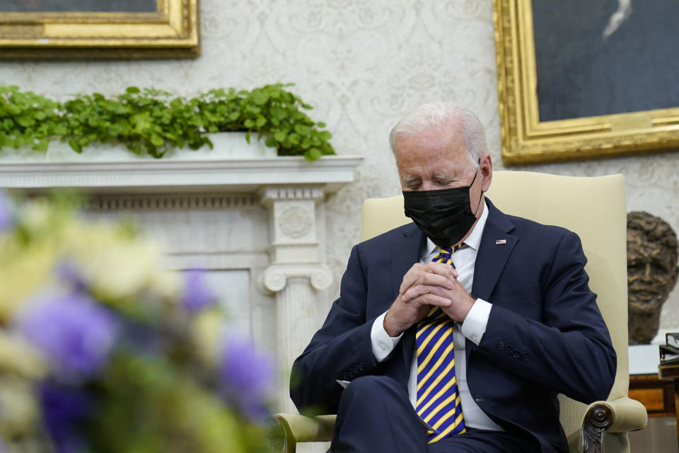 President Joe Biden listens as Kenyan President Uhuru Kenyatta speaks during their meeting in the Oval Office of the White House in Washington, Thursday, Oct. 14, 2021. (AP Photo/Susan Walsh)