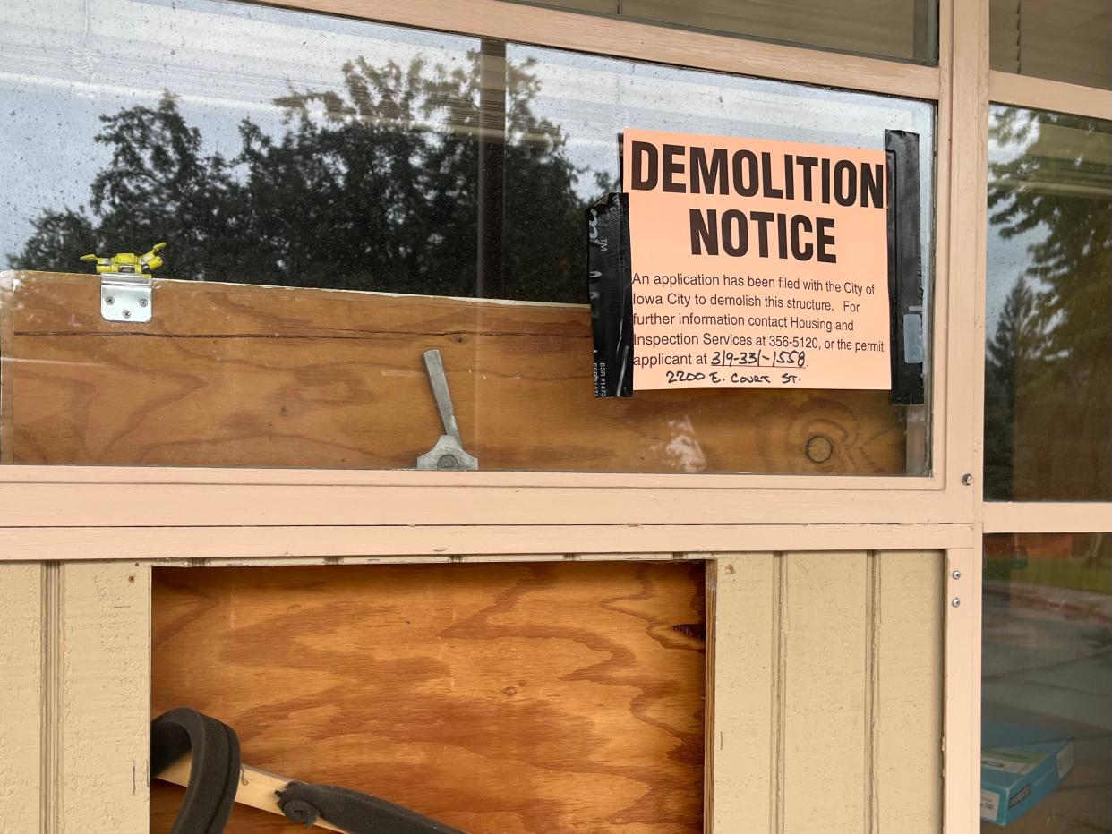 A demolition notice taped to a window at the former Hoover Elementary at 2200 E/ Court St. in Iowa City is seen Friday, the day work began on tearing down the 68-year-old building.