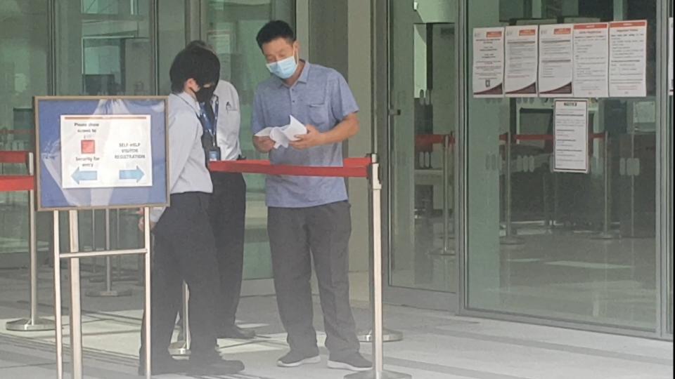 Liu Dufeng leaving the State Courts on Friday (17 April) after he was charged. (PHOTO:Yahoo News Singapore/Wan Ting Koh)