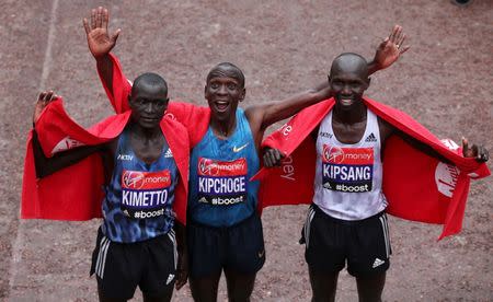 Athletics - Virgin Money London Marathon - London - 26/4/15 Kenya's Eliud Kipchoge (1st), Kenya's Wilson Kipsang (2nd) and Kenya's Dennis Kimetto (3rd) pose after the the Men's Elite race Action Images via Reuters / Paul Childs Livepic