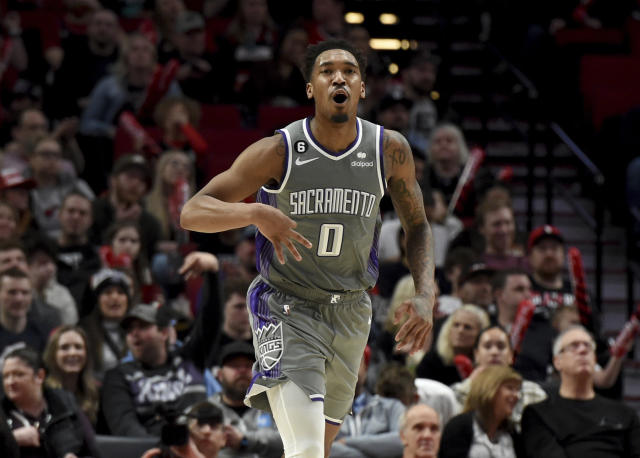 Sacramento Kings guard Malik Monk reacts after hitting a shot during the second half of an NBA basketball game against the Portland Trail Blazers in Portland, Ore., Wednesday, March 29, 2023. The Kings won 120-80. (AP Photo/Steve Dykes)