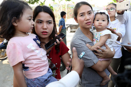 Families of jailed Reuters reporters Wa Lone and Kyaw Soe Oo talk to the media after attending a hearing at Myanmar's Supreme Court in Naypyitaw, Myanmar, March 26, 2019. REUTERS/Ann Wang