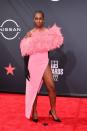 <p><em>The Umbrella Academy</em> star looked lovely in a bright pink feathered gown, black opera gloves, and matching heels.</p>