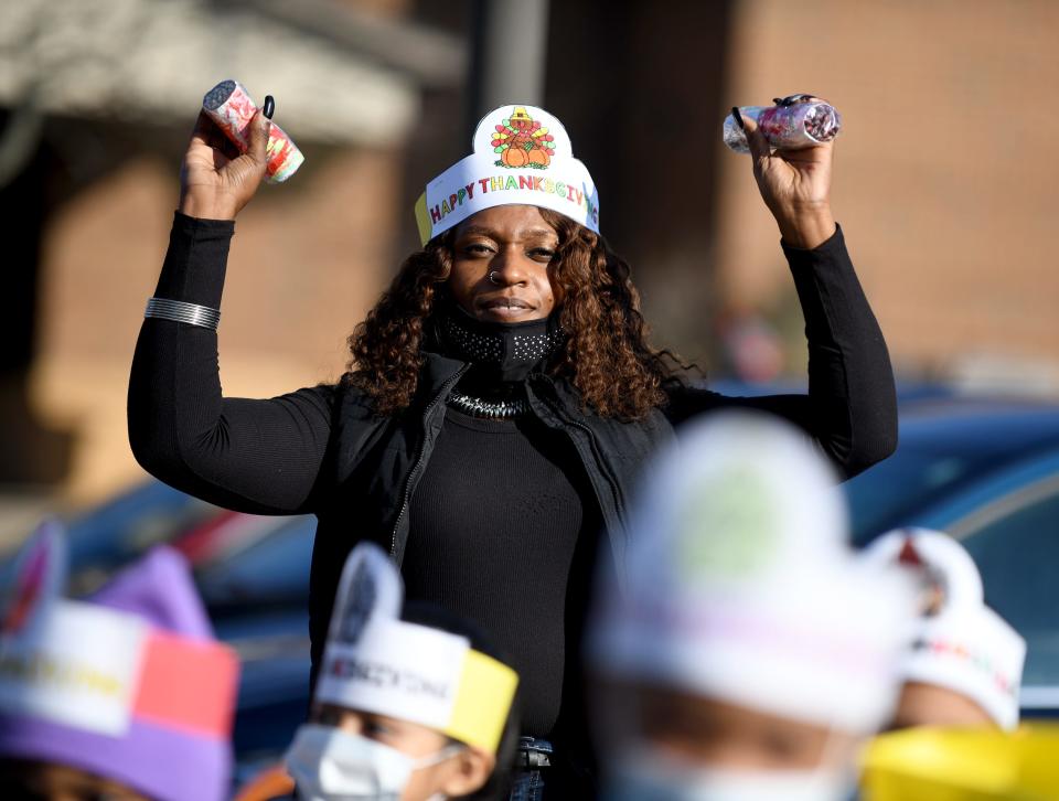 Heather Fields leads her Gibbs Elementary kindergarten students Tuesday as they participate in a Thanksgiving Parade modeled after the Macy's Thanksgiving Day Parade and using the book "Balloons over Broadway."