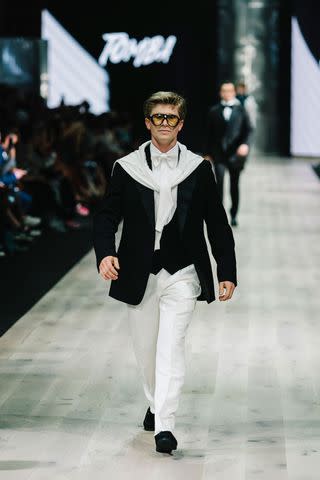 <p>Naomi Rahim/WireImage</p> Robert Irwin walks his first catwalk at the Suit Up Runway show