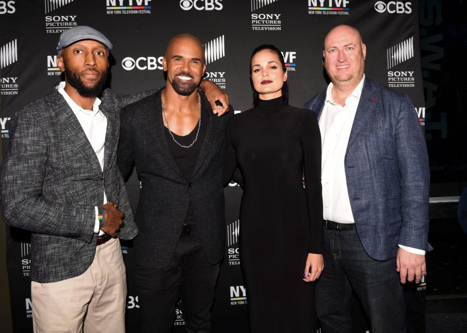 "S.W.A.T." actors Aaron Rahsaan Thomas (left), Shemar Moore and Lina Esco, and executive producer Shawn Ryan appear at premiere-season event for the CBS police drama in 2017. Thomas is one of the few Black executive producers on a network police show.