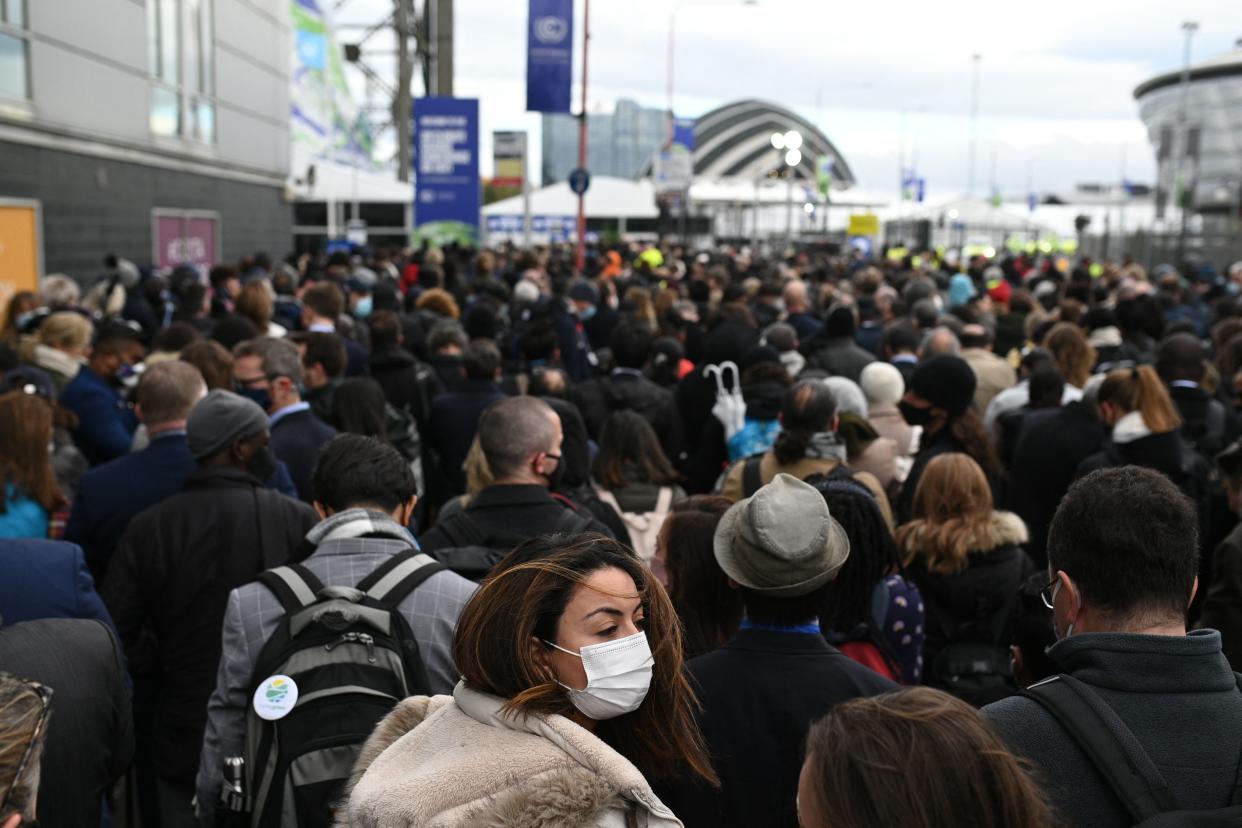 Attendees queue to pass security and enter the Scottish Event Campus (SEC) in Glasgow on November 1, 2021 on the second day of the COP26 UN Climate Change Conference. - More than 120 world leaders meet in Glasgow in a 