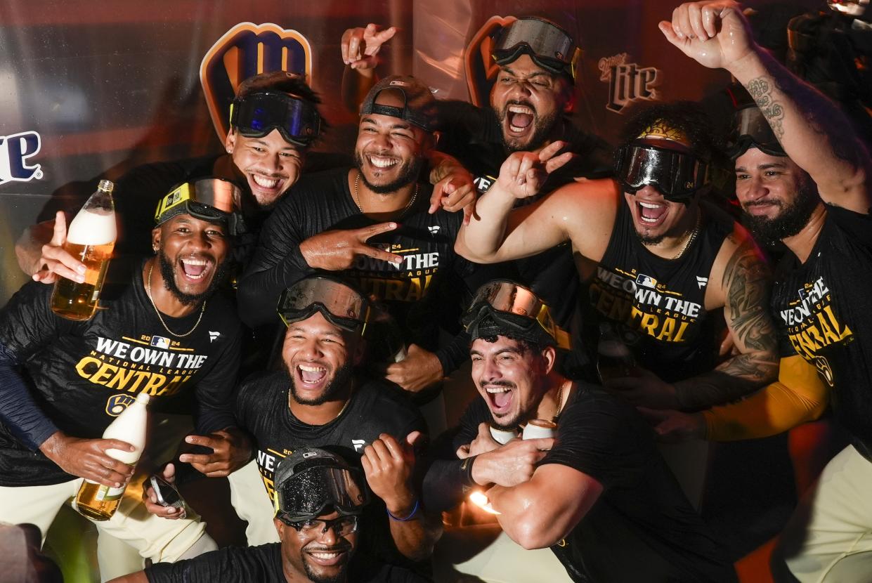 The Milwaukee Brewers celebrate after a baseball game against the Philadelphia Phillies Wednesday, Sept. 18, 2024, in Milwaukee. The Brewers won 2-1 and clinched the National League Central division. (AP Photo/Morry Gash)