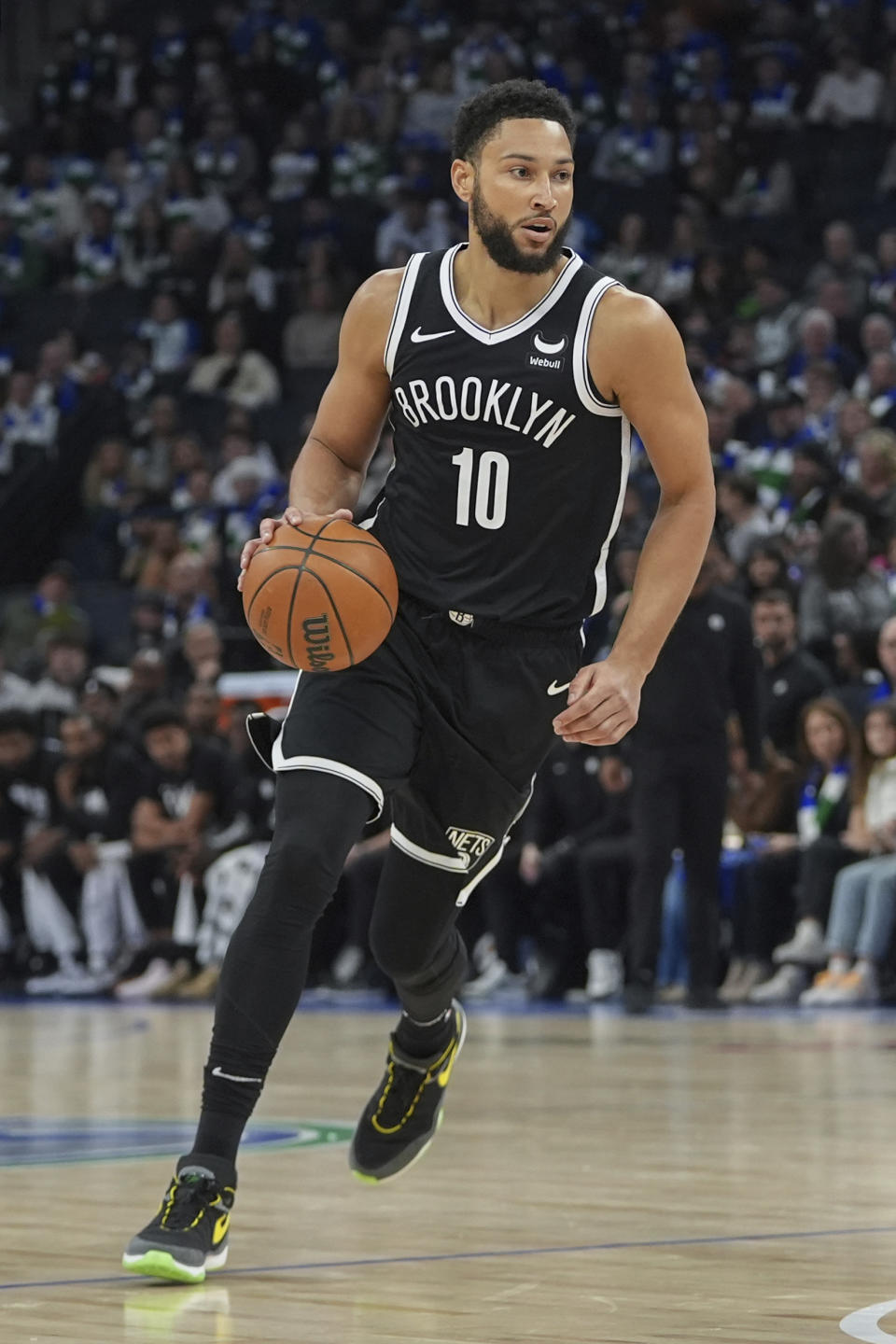 Brooklyn Nets guard Ben Simmons brings the ball up during the first half of the team's NBA basketball game against the Minnesota Timberwolves, Saturday, Feb. 24, 2024, in Minneapolis. (AP Photo/Abbie Parr)