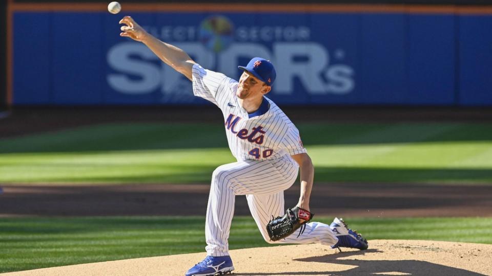 Chris Bassitt full stride pitching home uniform day game