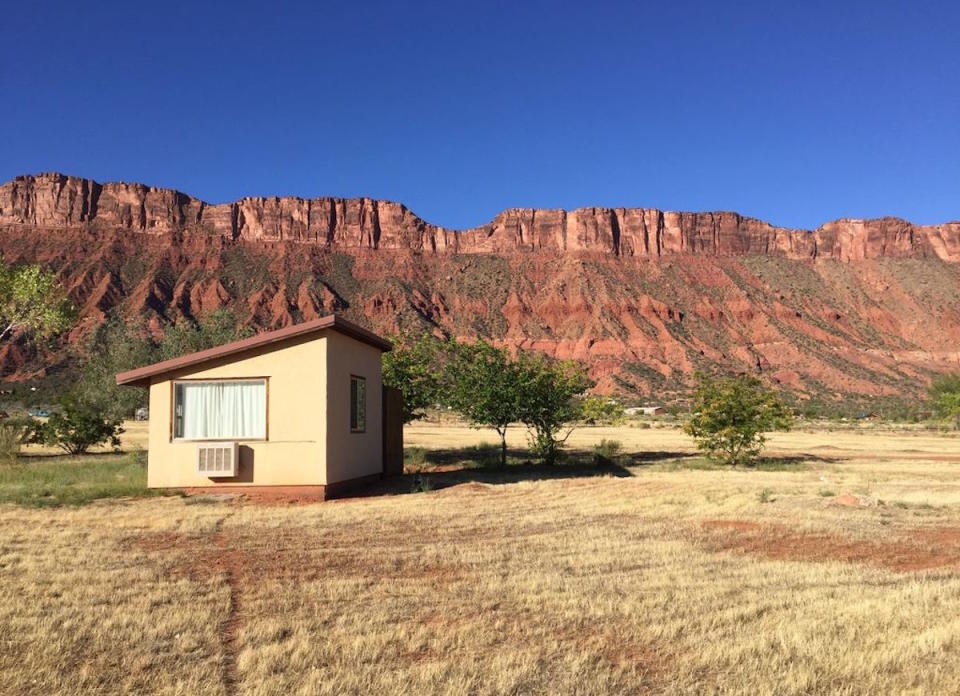 <body> <p>If you can't take the desert heat, seek shelter in this inviting, asymmetrical sanctuary in Castle Valley, Utah. Situated against a dramatic <a rel="nofollow noopener" href=" http://www.bobvila.com/slideshow/9-warm-and-cozy-ski-chalets-for-the-21st-century-46404?bv=yahoo" target="_blank" data-ylk="slk:mountain backdrop;elm:context_link;itc:0;sec:content-canvas" class="link ">mountain backdrop</a>, the one-room studio offers an escape from the harsh elements and the rugged terrain. The property includes a nearby solar-powered well and is surrounded by shrubs and trees for added shade.</p> <p><strong>Related: <a rel="nofollow noopener" href=" http://www.bobvila.com/slideshow/home-alone-10-beautiful-homes-in-the-middle-of-nowhere-47301?#.WD-sXqIrKRs?bv=yahoo" target="_blank" data-ylk="slk:Home Alone: 10 Beautiful Homes in the Middle of Nowhere;elm:context_link;itc:0;sec:content-canvas" class="link ">Home Alone: 10 Beautiful Homes in the Middle of Nowhere</a> </strong> </p> </body>