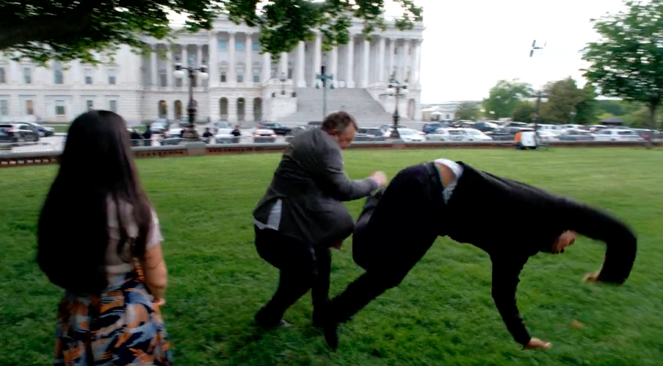 Senator Jon Tester is seen jokingly tackling Senator Cory Booker in a recent political ad (Jon Tester/Twitter)