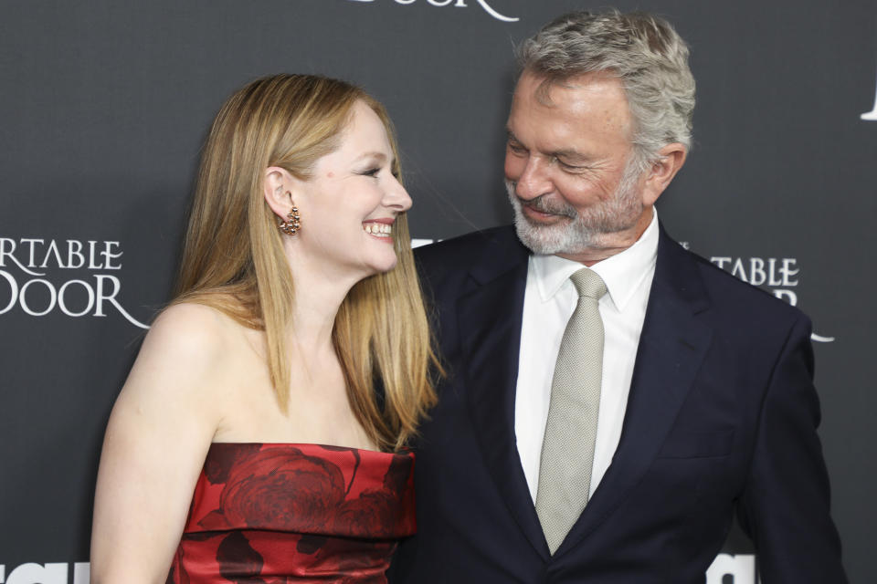 <p>Miranda Otto and <a href="https://people.com/movies/sam-neill-calls-robin-williams-funniest-yey-saddest-person/" rel="nofollow noopener" target="_blank" data-ylk="slk:Sam Neill;elm:context_link;itc:0;sec:content-canvas" class="link ">Sam Neill</a> share a laugh while at the world premiere of <em>The Portable Door</em> in Sydney, Australia, on March 23.</p>