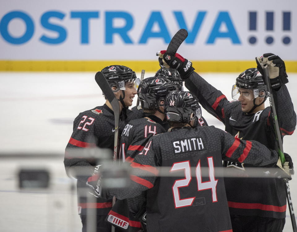 Canada's Dylan Cozens (22), Jared McIssac (14), Liam Foudy (8), Ty Smith (24) and Joe Veleno (9) celebrate their seventh goal against the Czech Republic team during third period action at the World Junior Hockey Championships on Tuesday, Dec. 31, 2019 in Ostrava, Czech Republic. (Ryan Remiorz/The Canadian Press via AP)