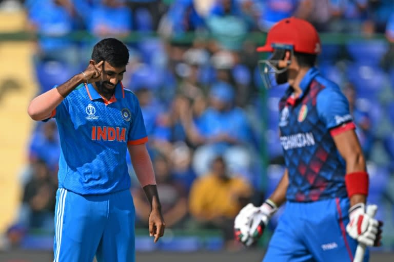 Not Marcus Rashford!: India's Jasprit Bumrah celebrates after taking the wicket of Afghanistan's Ibrahim Zadran (Money SHARMA)