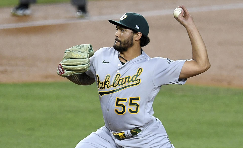 Sean Manaea #55 of the Oakland Athletics throws to the plate against the Los Angeles Dodgers in the first inning of a MLB baseball game at Dodger Stadium in Los Angeles on Wednesday, September 23, 2020. (Keith Birmingham/The Orange County Register via AP)