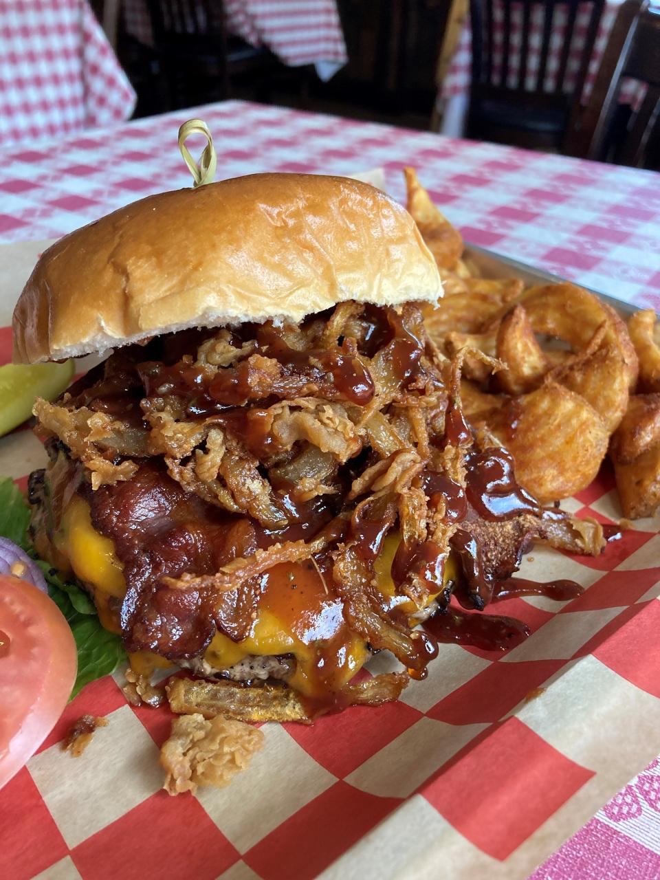 The Bobb-O burger at Brookside Tavern in Valley Cottage. The burger is topped with cheddar cheese, crispy onions, bacon and whiskey barbecue sauce. Photographed Jan. 20, 2022.