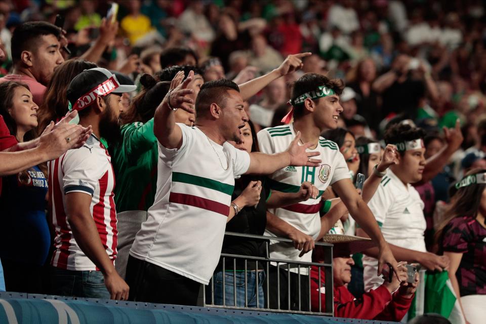 Mexico fans react in extra time against the United States during the 2021 CONCACAF Nations League Finals soccer series final match at Empower Field at Mile High.