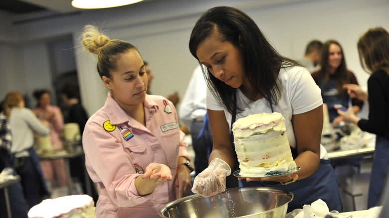 Two women at a cake decorating class