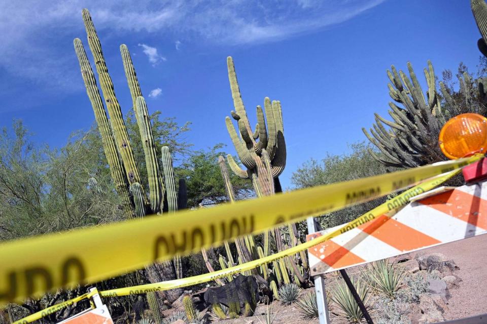 PHOTO: FILE - Caution tape is seen at a construction site near saguaro cactus at the Phoenix botanical gardens in Phoenix, Aug. 1, 2023. (Andrew Caballero-reynolds/AFP via Getty Images, FILE)